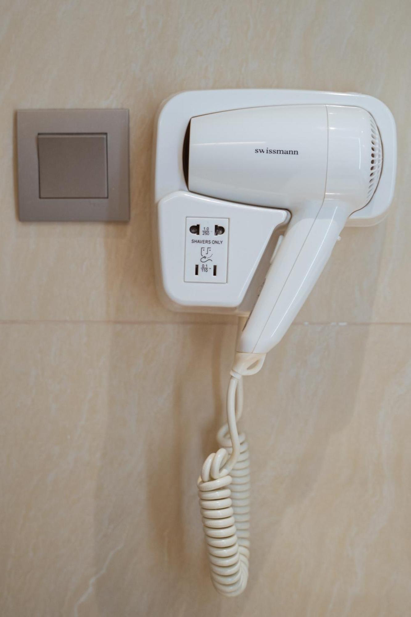 Centre Point Hotel Terminal21 Korat Nakhonratchasima Esterno foto A wall-mounted hair dryer
